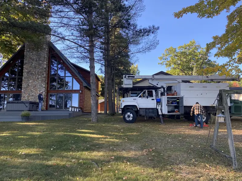 Bucket truck set up at an A-frame in the fall